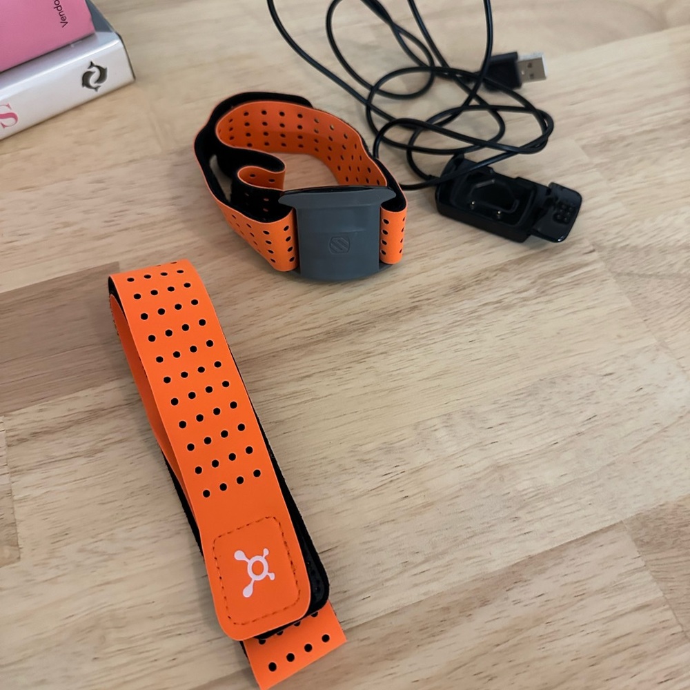 Orange Theory heart monitor and charger
